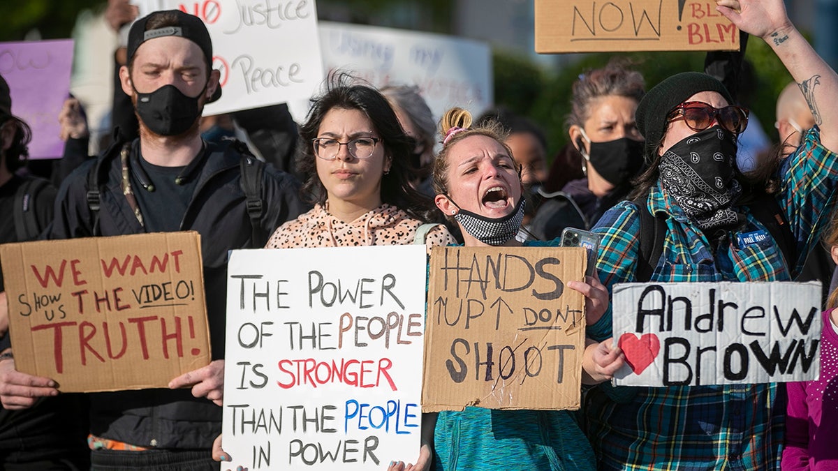 Demonstrators organize on Colonial Avenue to march, Thursday, April 22, 2021, in Elizabeth City, N.C., in reaction to the death of Andrew Brown Jr. (Robert Willett/The News &amp; Observer via AP)