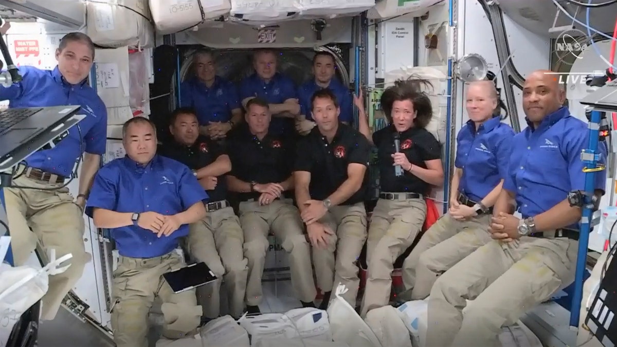 This image provided by NASA, astronauts from SpaceX join the astronauts of the International Space Station for an interview on Saturday, April 24, 2021. A recycled SpaceX capsule carrying four astronauts has arrived at the International Space Station, a day after launching from Florida. The Dragon capsule docked autonomously with the orbiting outpost on Saturday. (NASA via AP)