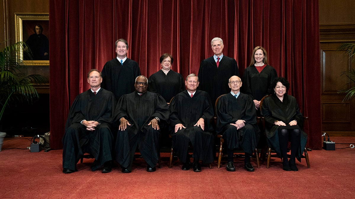 In this April 23, 2021, file photo members of the Supreme Court pose for a group photo at the Supreme Court in Washington. Seated from left are Associate Justice Samuel Alito, Associate Justice Clarence Thomas, Chief Justice John Roberts, Associate Justice Stephen Breyer and Associate Justice Sonia Sotomayor, Standing from left are Associate Justice Brett Kavanaugh, Associate Justice Elena Kagan, Associate Justice Neil Gorsuch and Associate Justice Amy Coney Barrett. (Erin Schaff/The New York Times via AP, Pool, File)