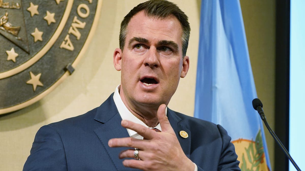 FILE - In this Feb. 11, 2021 file photo, Oklahoma Gov. Kevin Stitt speaks during a news conference in Oklahoma City. Gov. Stitt is signing three anti-abortion bills into law. Stitt announced on Twitter Monday, April 26, 2021, that he'd signed bills requiring physicians who perform abortions to be certified in obstetrics, adding performing abortions to the list of unprofessional conduct by doctors and prohibiting abortions of a fetal heartbeat is detected. (AP Photo/Sue Ogrocki File)