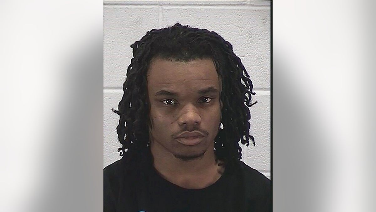 Edward James McGee and a juvenile have been charged in connection with a violent carjacking that left a mother of two paralyzed. (Aurora Police Department via AP)
