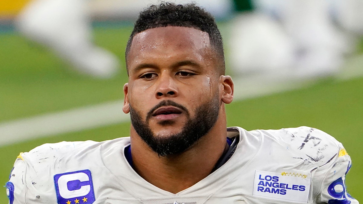 FILE - Los Angeles Rams defensive end Aaron Donald (99) walks off the field after a loss to the New York Jets in an NFL football game in Inglewood, Calif., in this Sunday, Dec. 20, 2020, file photo. A lawyer and his 26-year-old client told Pittsburgh police Wednesday, April 14, 2021, that Los Angeles Rams defensive lineman Aaron Donald and others assaulted the man at a nightclub last weekend, causing multiple injuries. (AP Photo/Jae C. Hong, File)