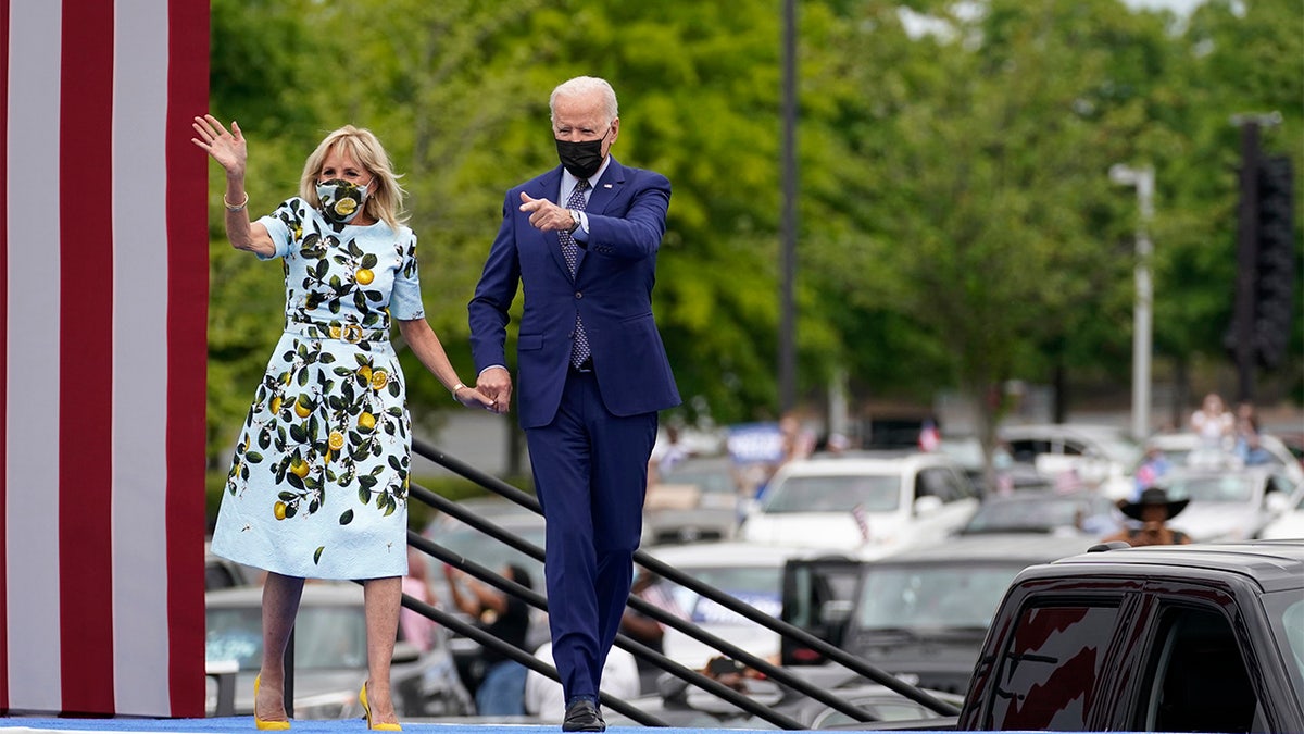 President Joe Biden and first lady Jill Biden arrive for a rally at Infinite Energy Center, to mark his 100th day in office, Thursday, April 29, 2021, in Duluth, Ga. (AP Photo/Evan Vucci)