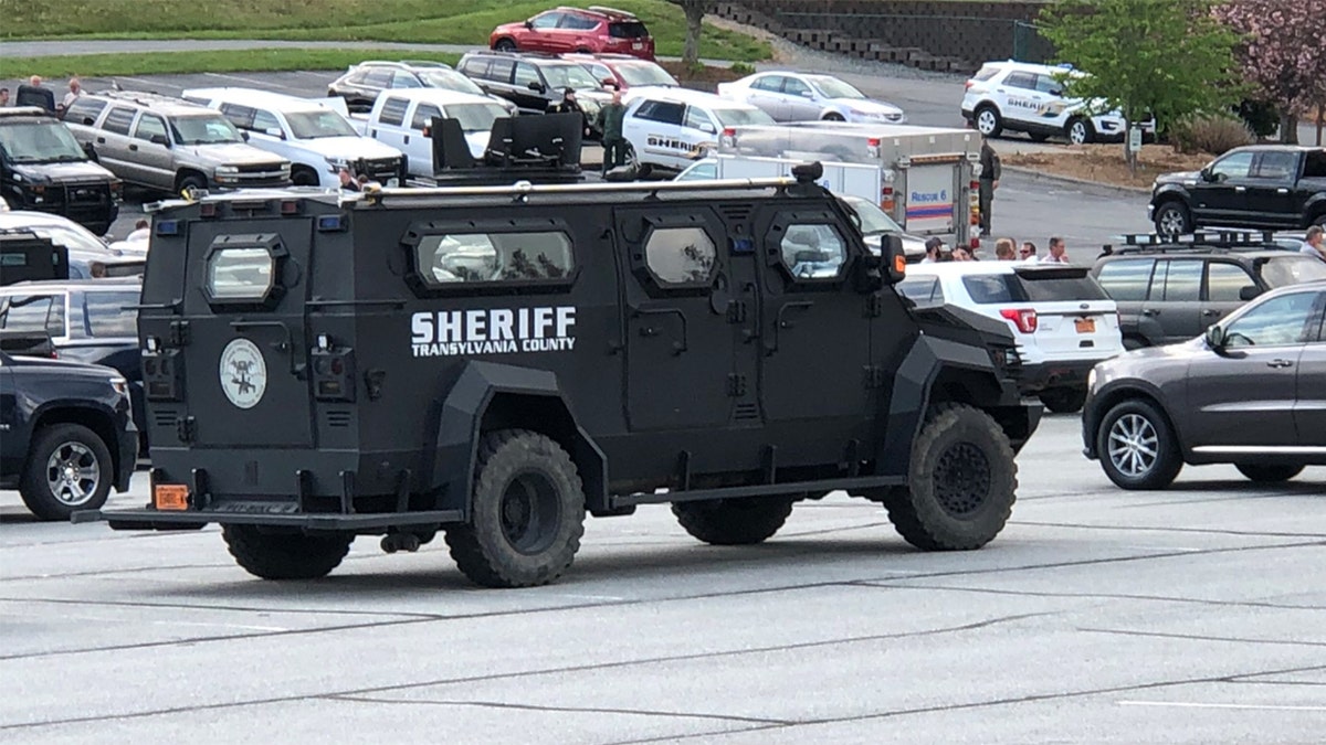 A tactical vehicle at the staging area in a church parking lot near the scene of the standoff.