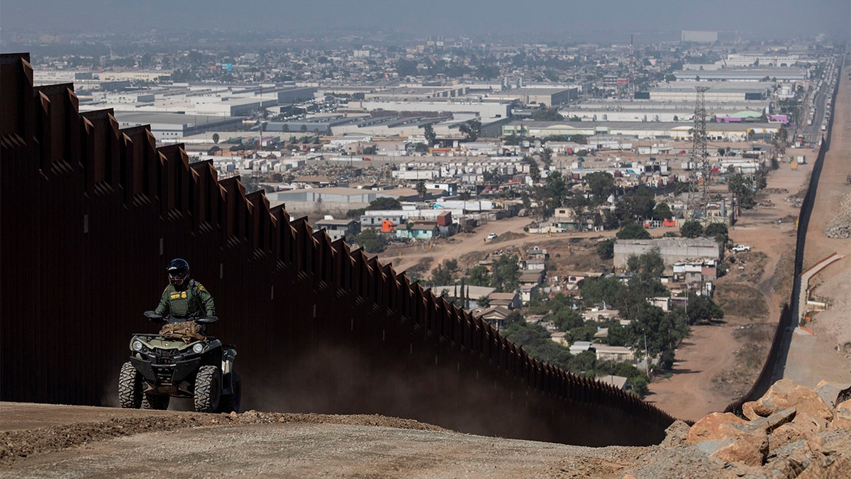 A border patrol agent patrols along a construction site for the secondary border fence which follows the length of the primary border fence that separates the United States and Mexico in the San Diego Sector on August 22, 2019 in San Diego, CA. (Photo by Carolyn Van Houten/The Washington Post via Getty Images)