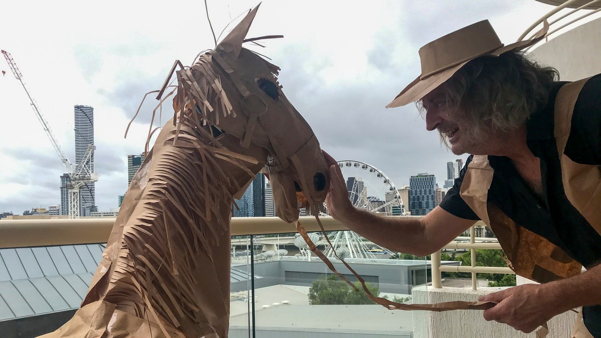 David Marriott used brown paper bags to turn himself into a paper cowboy during his two-week quarantine in a hotel in Australia. (David Marriott via AP)