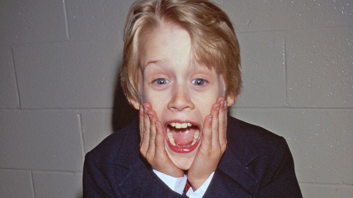 Macaulay Culkin makes a face like his "Home Alone" character.