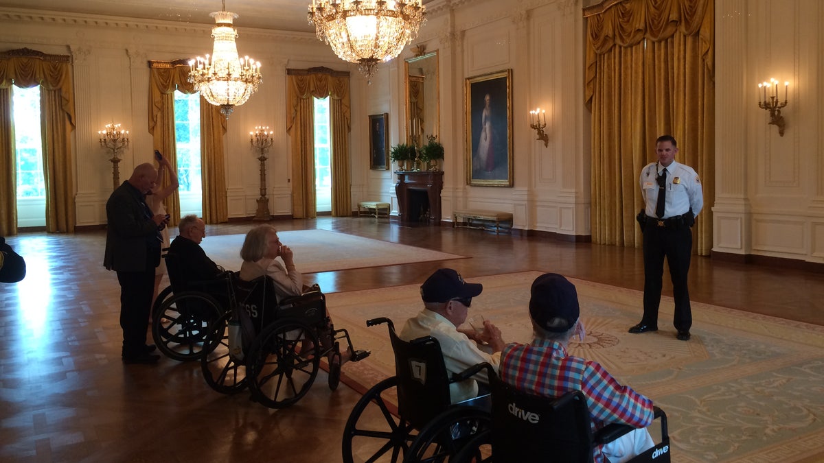 Sgt. Jonathan Stockeland showing World War II veterans around the White House. The 2017 tour included survivors of the USS Arizona. 