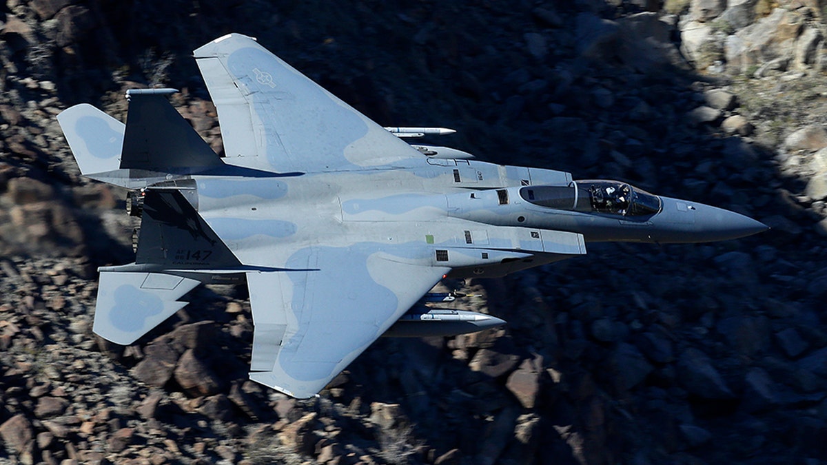 In this Feb. 28, 2017, photo, an F-15C Eagle from the California Air National Guard, 144th Fighter Wing, flies through the nicknamed Star Wars Canyon over Death Valley National Park, Calif. (AP Photo/Ben Margot)