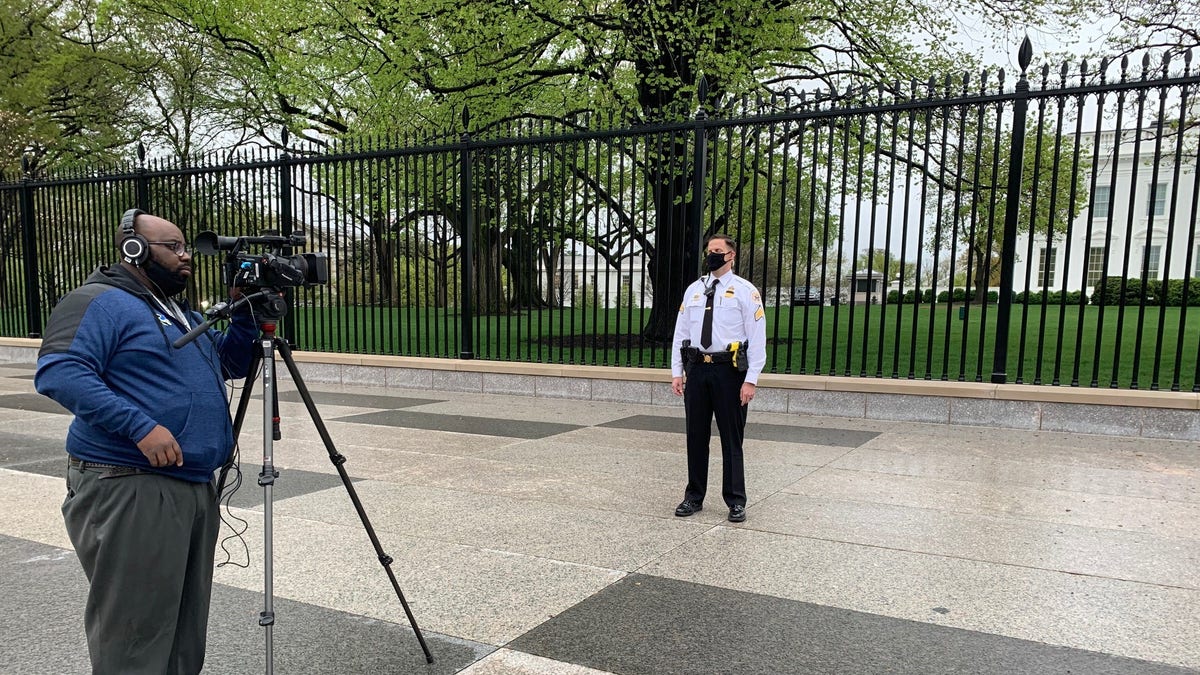 Sgt. Jonathan Stockeland films a message to celebrate veteran Ken Potts' 100th birthday.