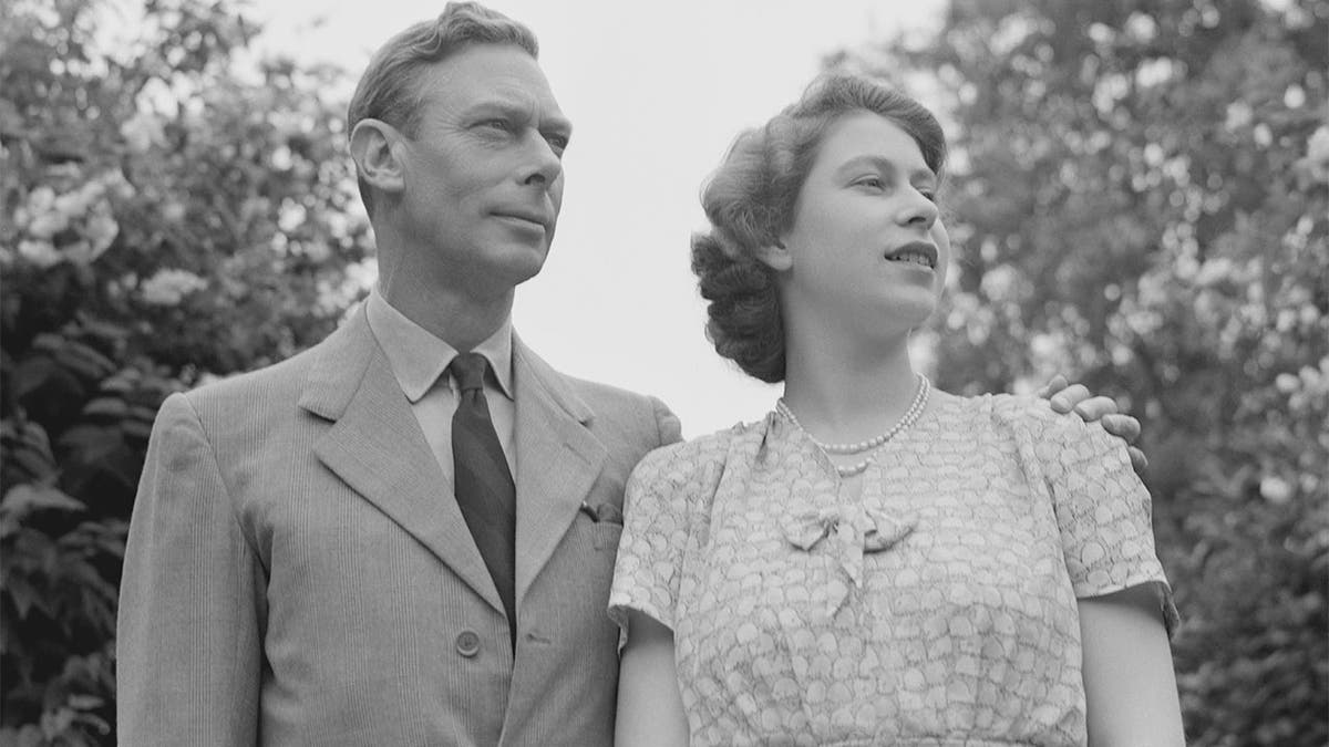 Princess Elizabeth with her father King George VI in the gardens at Windsor Castle, England on July 8, 1946.