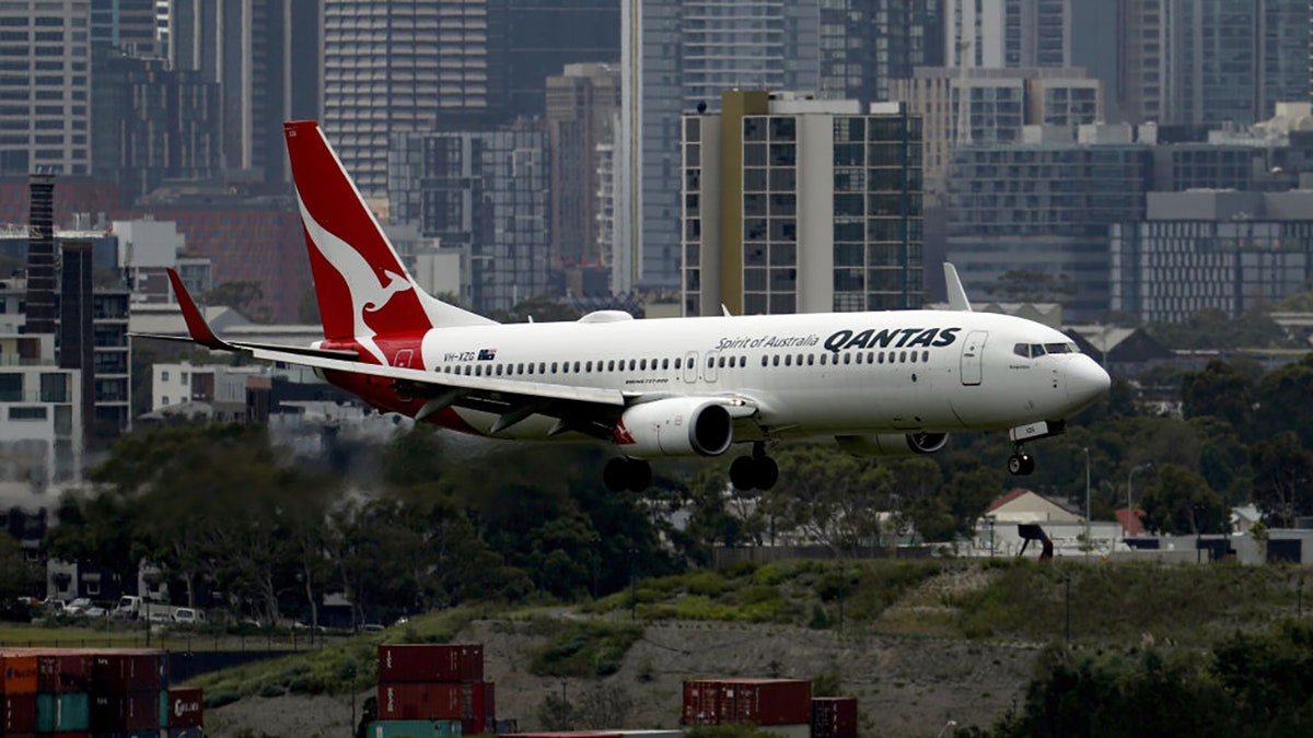 An aircraft operated by Qantas Airways Ltd. prepares to land at Sydney Airport in Sydney, Australia, on Wednesday, Feb. 17, 2021. Brendon Thorne/Bloomberg via Getty Images