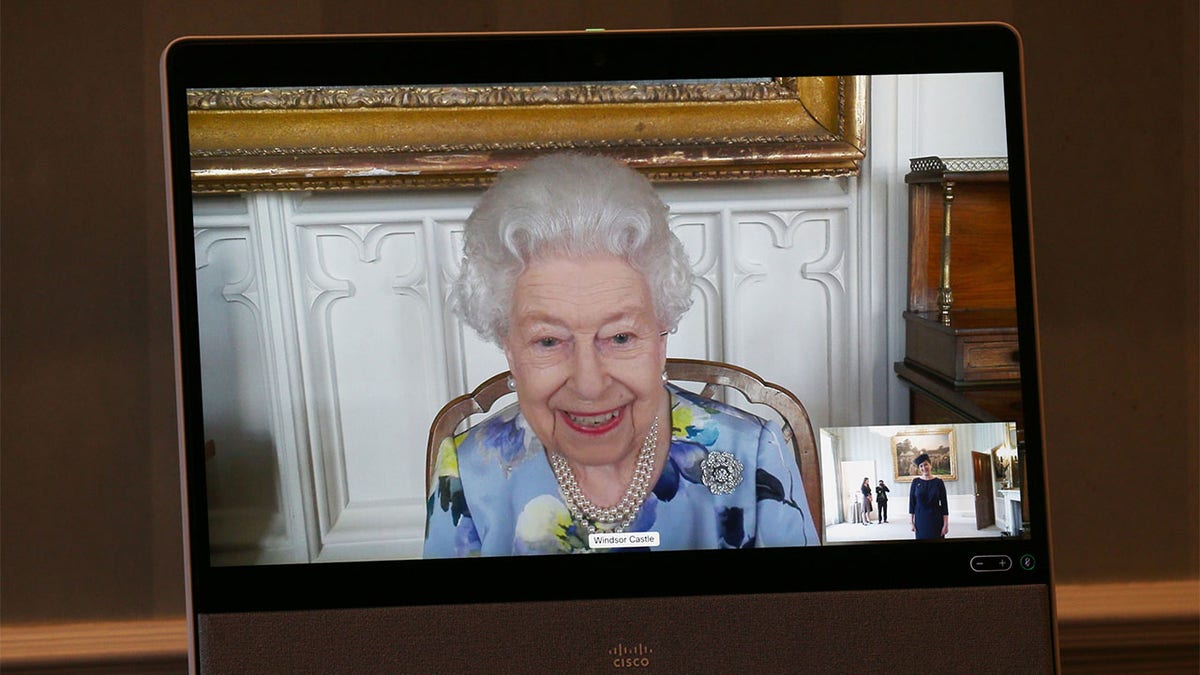 Queen Elizabeth II appears on a screen by videolink from Windsor Castle, where she is in residence, during a virtual audience to receive Her Excellency Ivita Burmistre, the Ambassador of Latvia at Buckingham Palace on April 27, 2021, in London, England. 