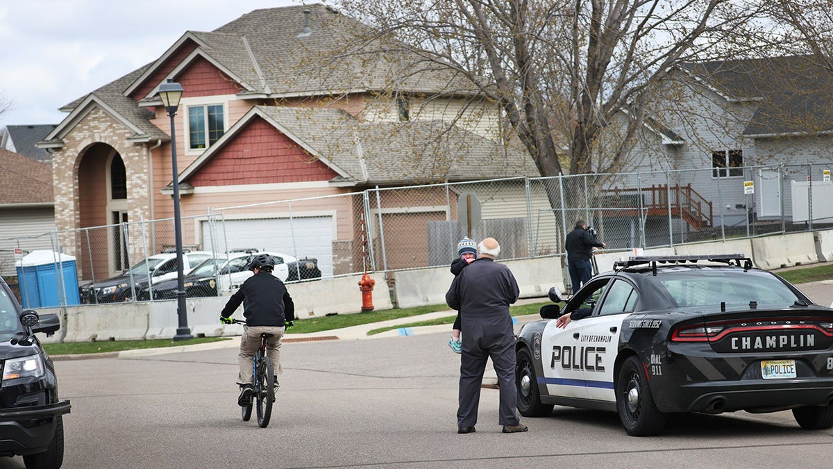 Barricades, security fencing and police officers protect the home of former Brooklyn Center police Officer Kimberly Potter on April 14, 2021 in Champlin, Minnesota.  (Photo by Scott Olson/Getty Images)