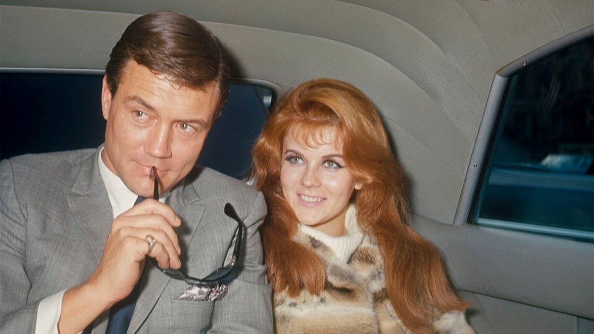 Roger Smith and Ann-Margret in the back of a limo; circa 1970; New York.