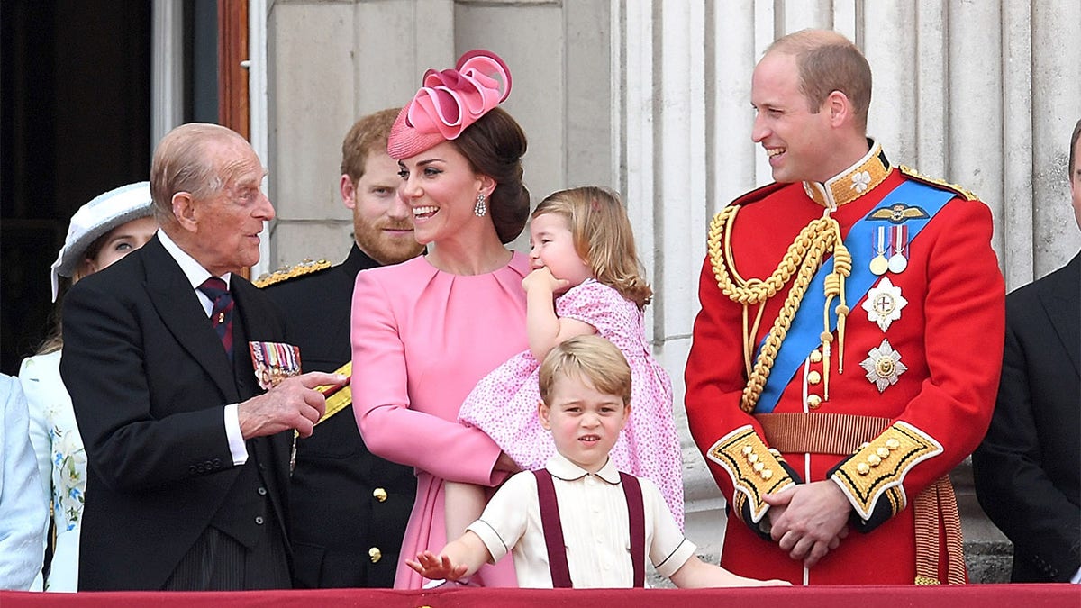 Prince Philip, Duke of Edinburgh, Catherine, Duchess of Cambridge, Princess Charlotte of Cambridge, Prince George of Cambridge and Prince William, Duke of Cambridge look on from the balcony during the annual Trooping The Colour parade at the Mall on June 17, 2017, in London, England.?