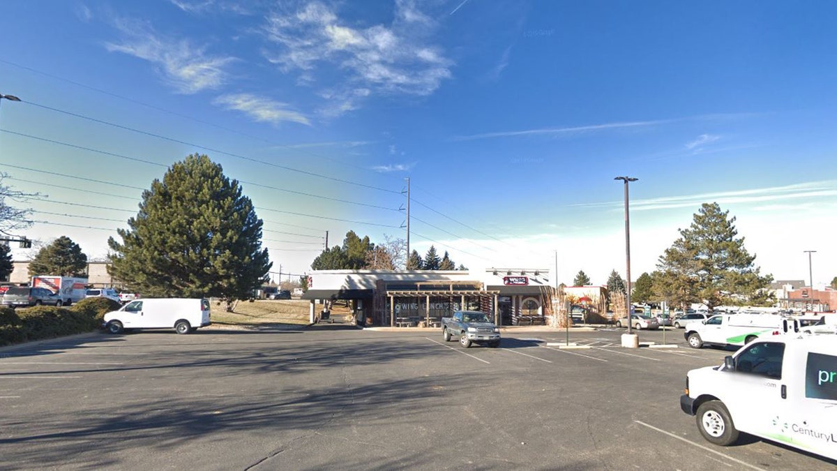 Investigators say the men robbed the woman at a Denver parking lot