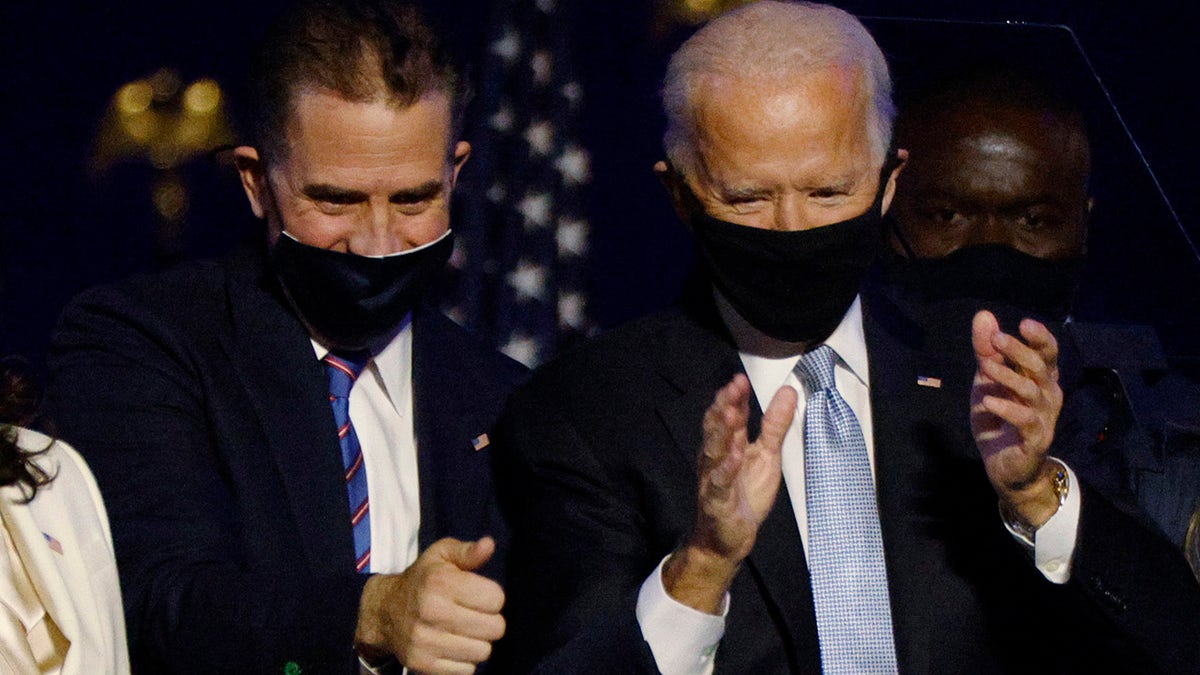 Joe Biden and his son Hunter celebrate onstage at his election rally, after the news media announced that Biden won the 2020 presidential election