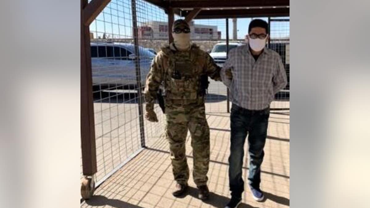 Juan Jose Bernabe Ramirez, 62, a Mexican citizen, is escorted to the U.S.-Mexico international boundary at the Paso del Norte Bridge in El Paso, Texas where he was turned over to Mexican authorities.