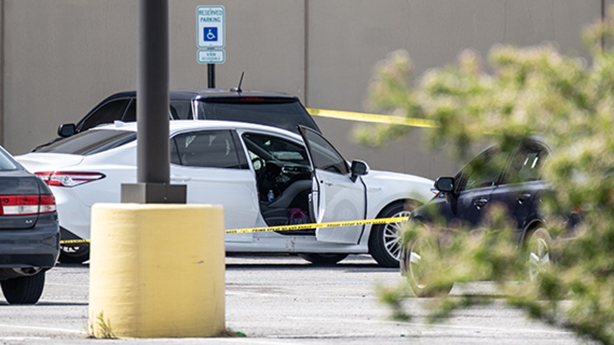 A vehicle with blood on the passenger side door sits vacant in the parking lot of a FedEx SmartPost on April 16, 2021 in Indianapolis, Indiana. (Jon Cherry/Getty Images)