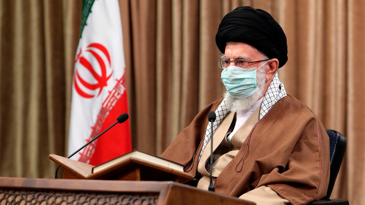 Ayatollah Ali Khamenei speaks while wearing mask