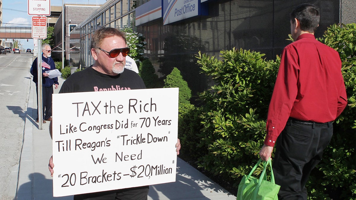This 2012 file photo shows James Hodgkinson of Belleville protesting outside the United States Post Office in Downtown Belleville, Ill. 