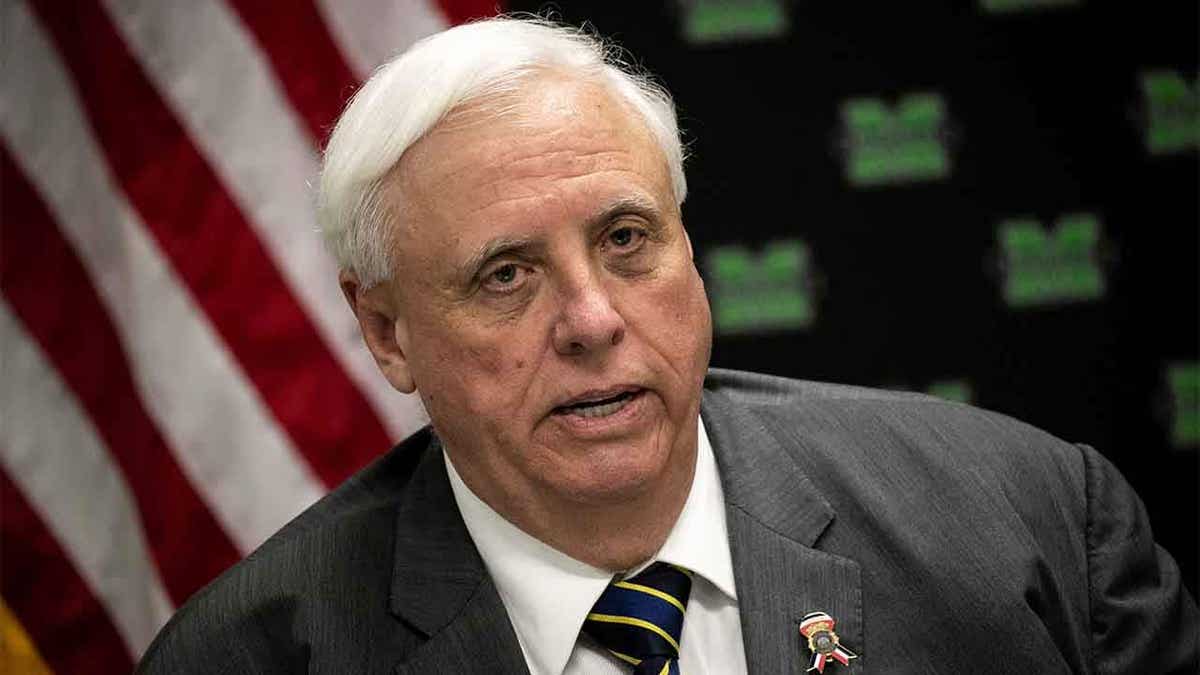 Jim Justice of West Virginia with American flag in background