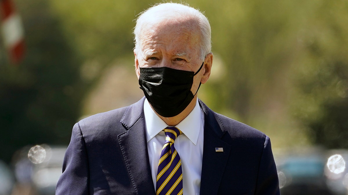 President Biden walks over to speak to members of the media after arriving on the Ellipse on the National Mall after spending the weekend at Camp David, Monday, April 5, 2021, in Washington. (AP Photo/Evan Vucci)
