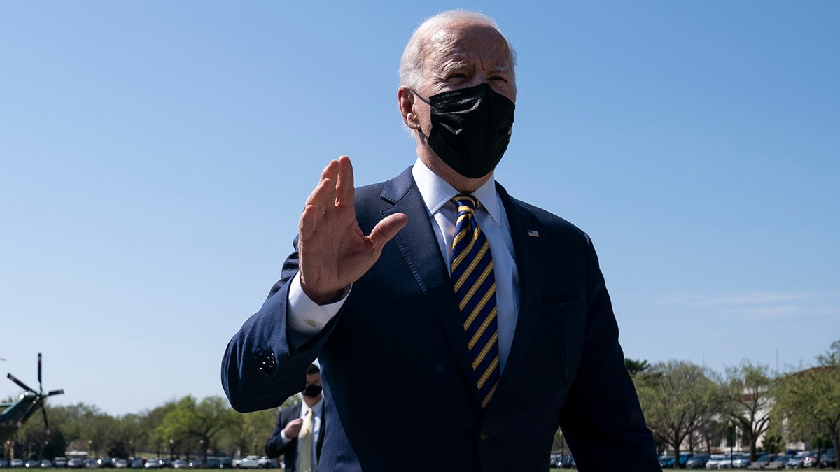 President Joe Biden talks with reporters on the Ellipse on the National Mall after spending the weekend at Camp David, Monday, April 5, 2021, in Washington. (AP Photo/Evan Vucci)