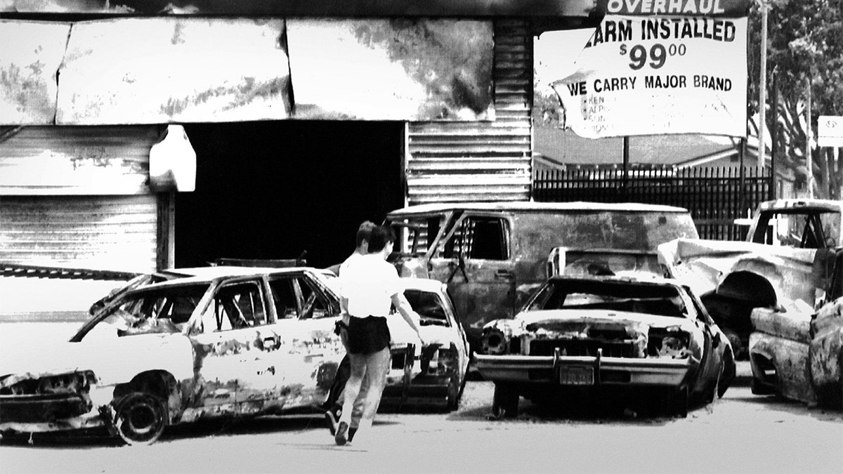 LOS ANGELES, CALIFORNIA - MAY 1: ?Burned-out cars at the intersection of Normandie and Florence in South Central Los Angeles after the Rodney King riots. Photographed May 1, 1992 in Los Angeles, CA. (Photo by /The Washington Post via Getty Images)