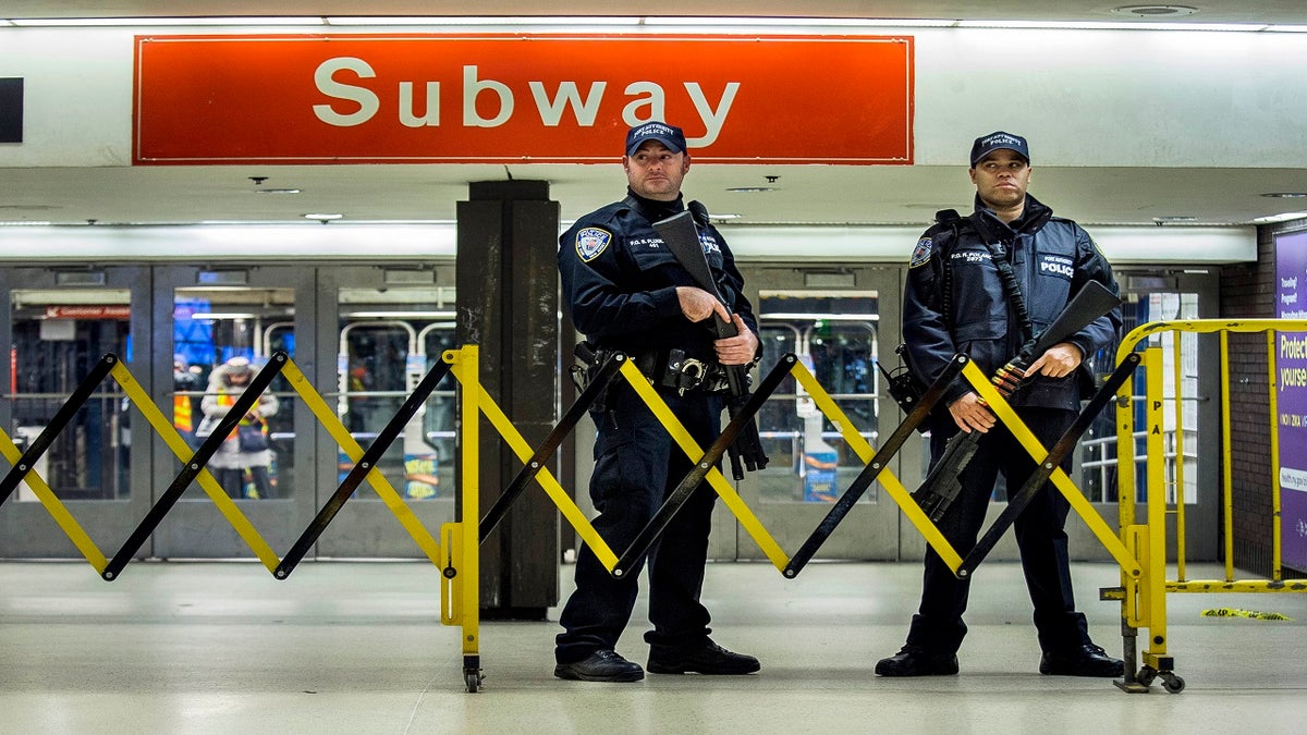 Police stand guard inside the Port Authority Bus Terminal on Dec. 11, 2017. (AP)