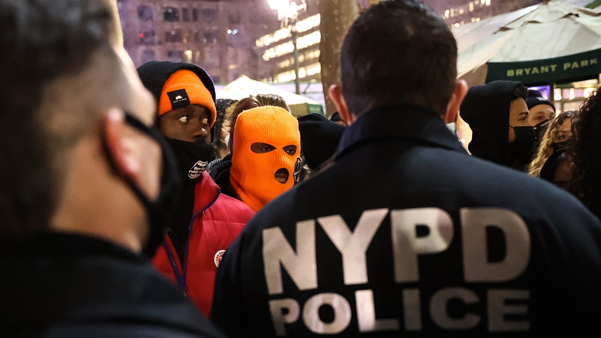 Police take measures as protesters gather at Bryant Park in New York City and march through the streets in memory of George Floyd on the first day of the trial of former Minneapolis police officer Derek Chauvin on March 8, 2021.