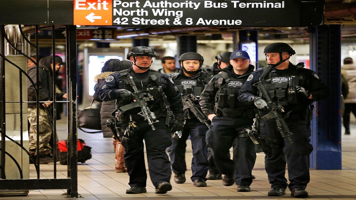 In this Dec. 12, 2017 photo, police officers patrol in the passageway connecting New York City's Port Authority bus terminal and the Times Square subway station, near the site of the explosion. (AP)