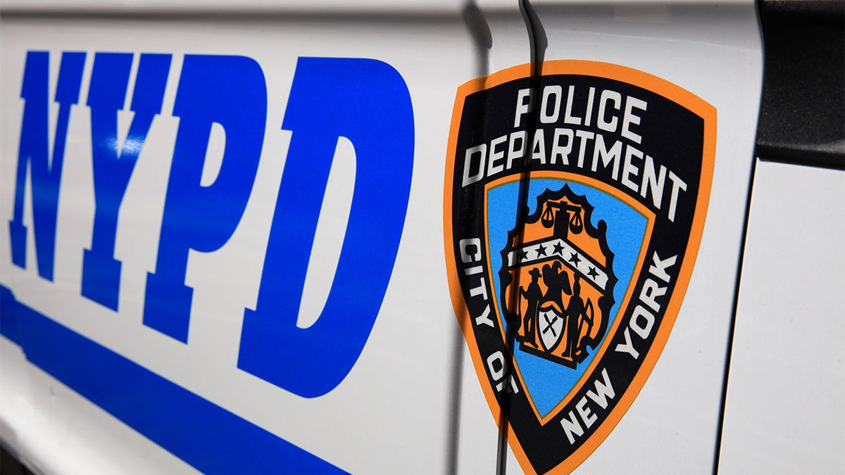 New York City, USA - April 29, 2019: NYPD (New York Police Department) Sign with Logo on Police Patrol Car in New York City. USA