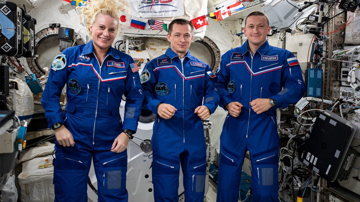 The three-member Expedition 64 crew from JAXA (Japan Aerospace Exploration Agency). From left are, Kate Rubins of NASA,Sergey Ryzhikov of Roscosmos and Sergey Kud-Sverchkov of Roscosmos.