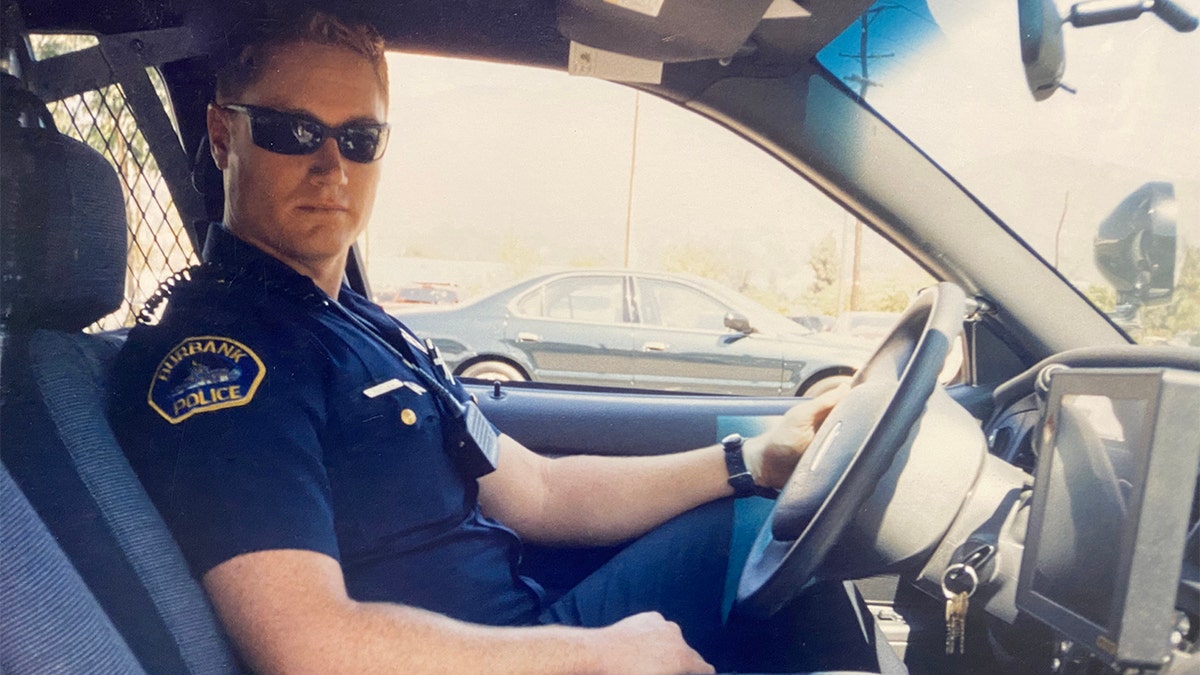 Officer Matthew Pavelka in his police cruiser.