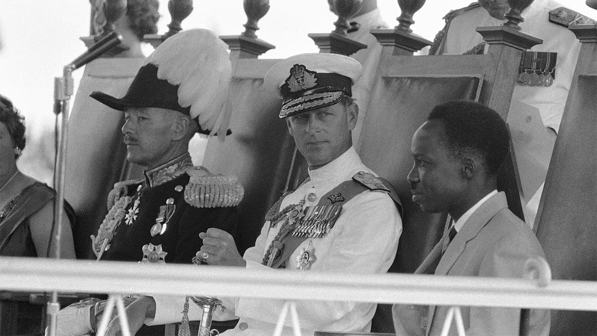 In this Dec. 9, 1961, file photo, Britain's Prince Philip, center, looks at Tanganyika Prime Minister Julius Nyerere, right, during the ceremony to swear in the new governor-general at the Independence celebrations in Dar-Es-Salaam, Tanganyika. (AP Photo/File)