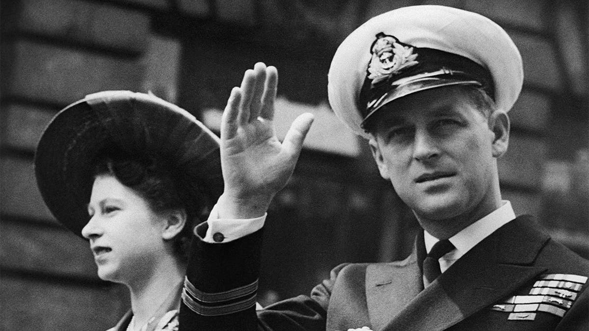 In this June 8, 1948 file photo, the Duke of Edinburgh seated beside Princess Elizabeth, acknowledges the cheers of the crowd as the open Landau passes through Fleet Street on way to the Guildhall in London. Buckingham Palace officials say Prince Philip, the husband of Queen Elizabeth II, has died, it was announced on Friday, April 9, 2021. He was 99. Philip spent a month in hospital earlier this year before being released on March 16 to return to Windsor Castle. Philip, also known as the Duke of Edinburgh, married Elizabeth in 1947 and was the longest-serving consort in British history.