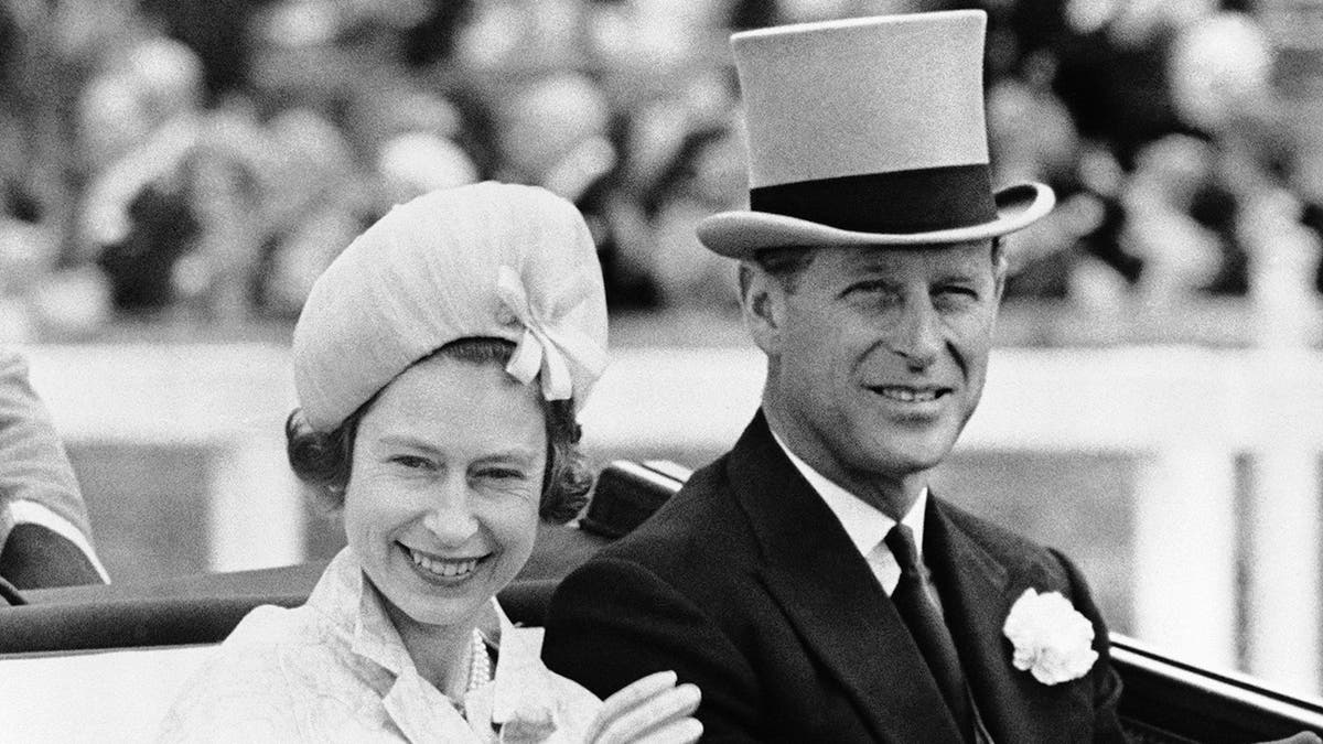 In this June 19, 1962 file photo, Britain's Prince Philip and his wife Queen Elizabeth II arrive at Royal Ascot race meeting, England. Buckingham Palace says Prince Philip, husband of Queen Elizabeth II, has died aged 99. Buckingham Palace says Prince Philip, husband of Queen Elizabeth II, has died aged 99.