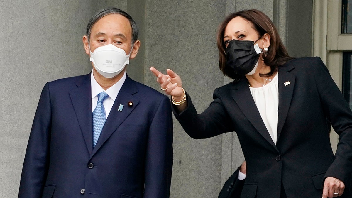 Japanese Prime Minister Yoshihide Suga meets Vice President Kamala Harris, Friday morning, April 16, 2021, on the balcony of the Eisenhower Executive Office Building on the White House campus in Washington. (Associated Press)