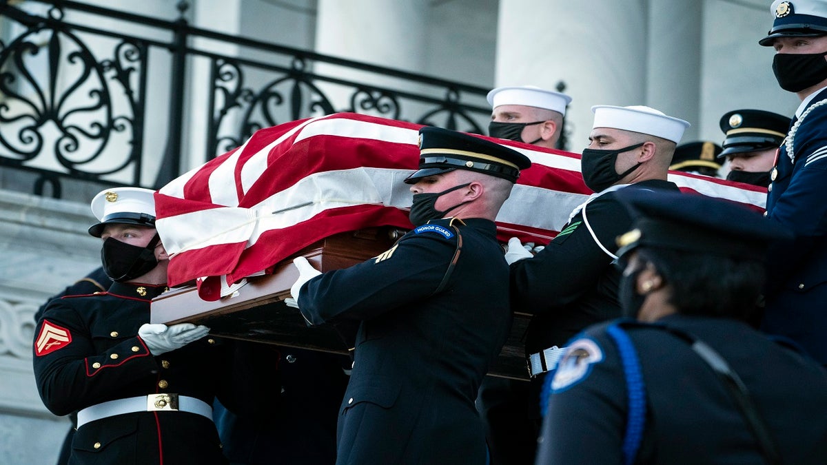 The casket of slain U.S. Capitol Police officer William "Billy" Evans is carried from the Capitol by a joint services honor guard Washington on Tuesday. (AP/The Washington Post)