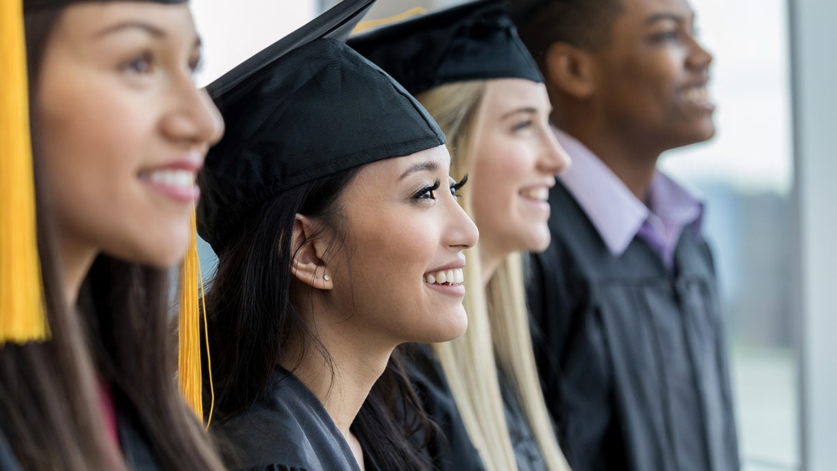 College grads smile