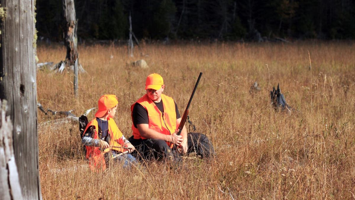 father and son are hunting