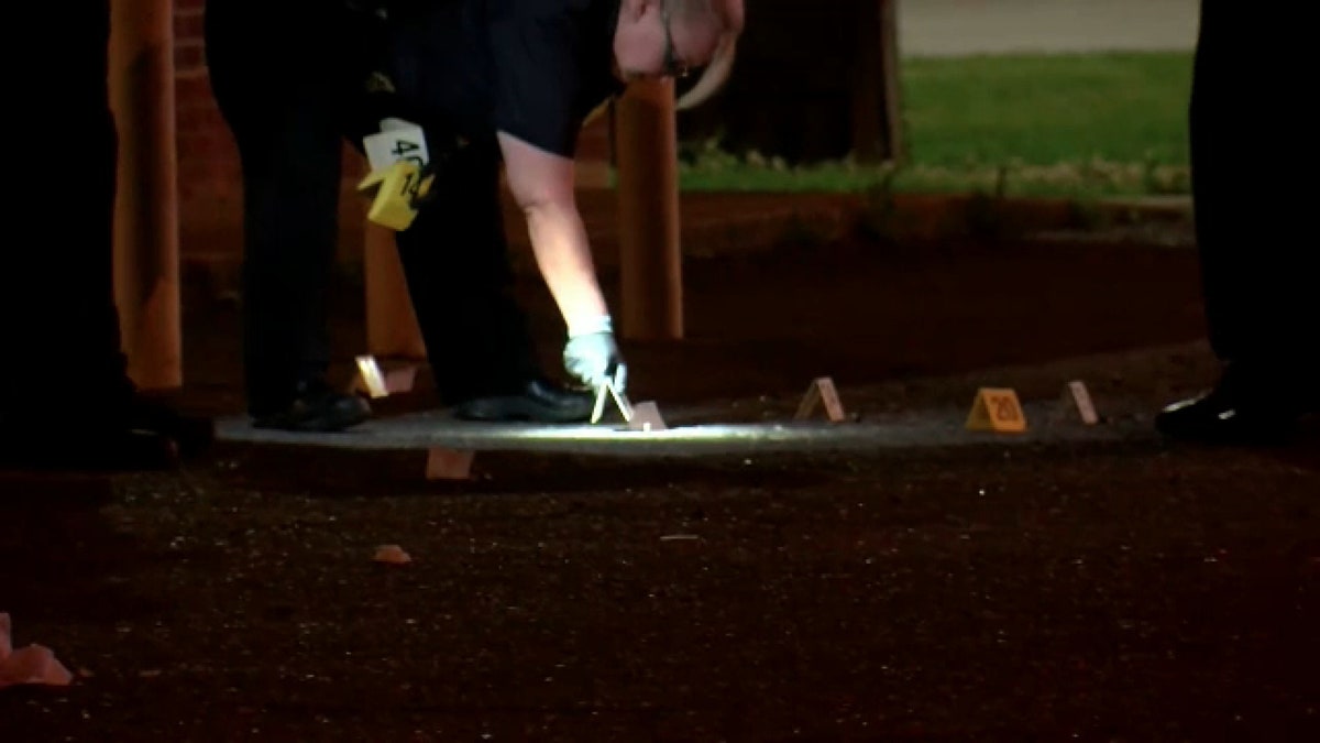 Authorities examine the crime scene