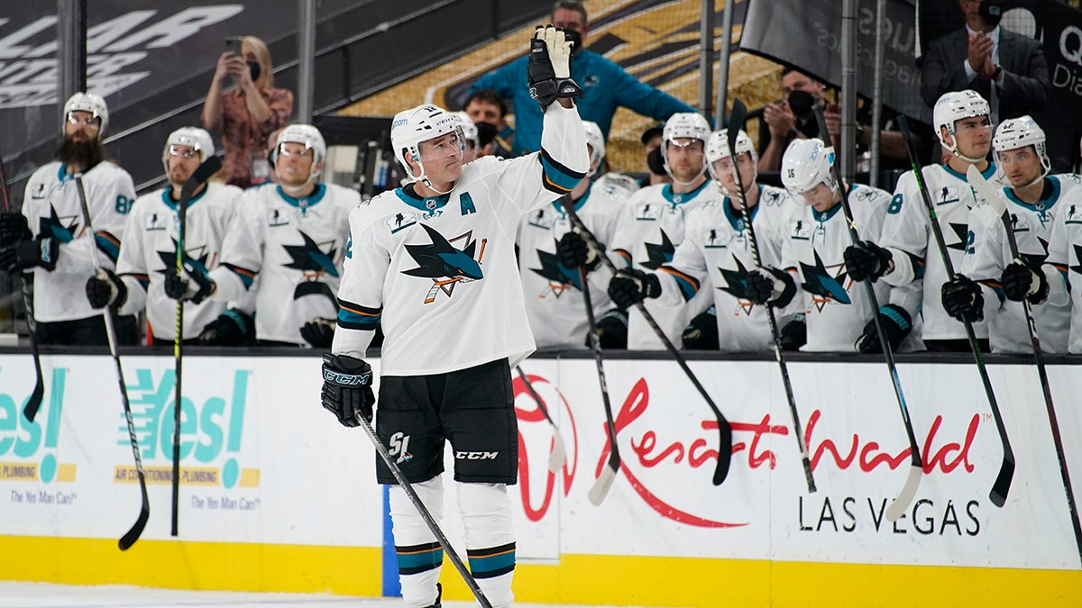 San Jose Sharks center Patrick Marleau (12) waves to the crowd during a small ceremony to mark his passing Gordie Howe for most NHL games played in the first period of an NHL hockey game Monday, April 19, 2021, in Las Vegas. (AP Photo/John Locher)