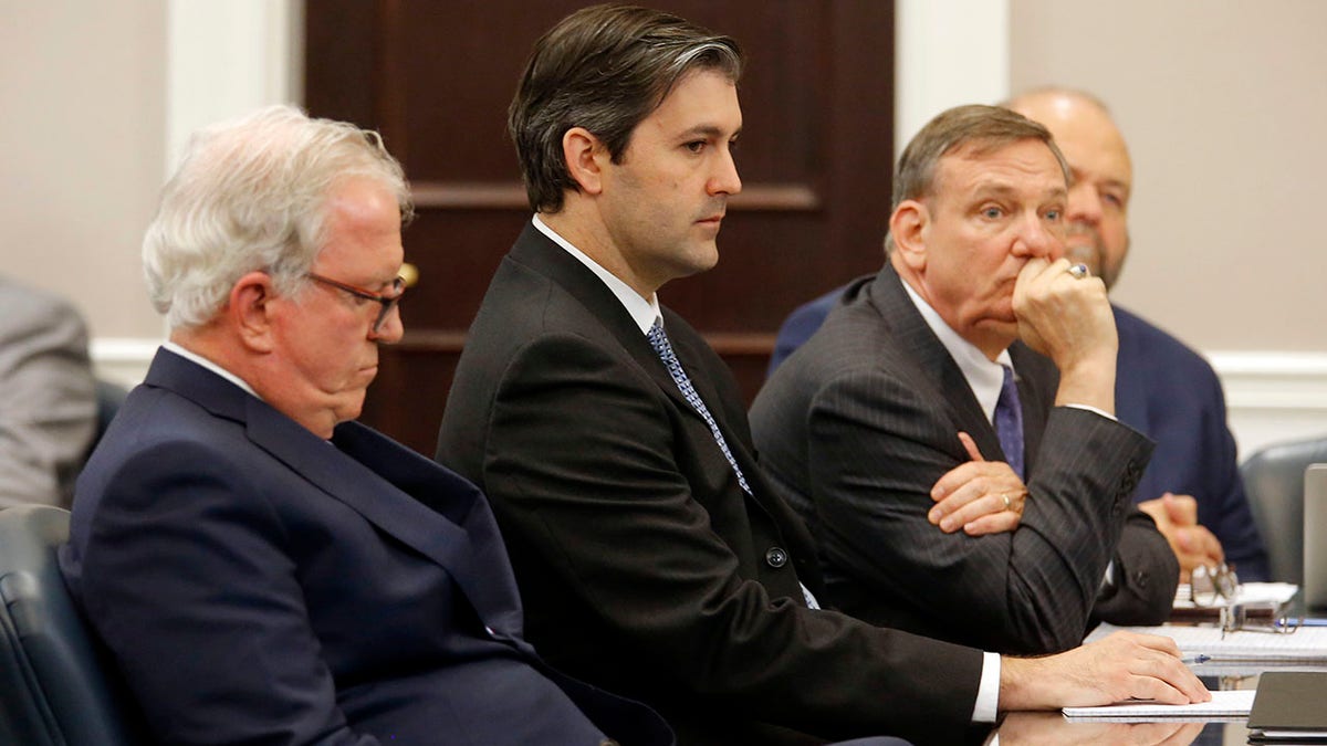 FILE - In this Dec. 5, 2016 file photo, defense attorneys Andy Savage, left, Don McCune, and Miller Shealy, right, sit around former North Charleston police officer Michael Slager at the Charleston County court in Charleston, S.C. (Grace Beahm/Post and Courier via AP, Pool)
