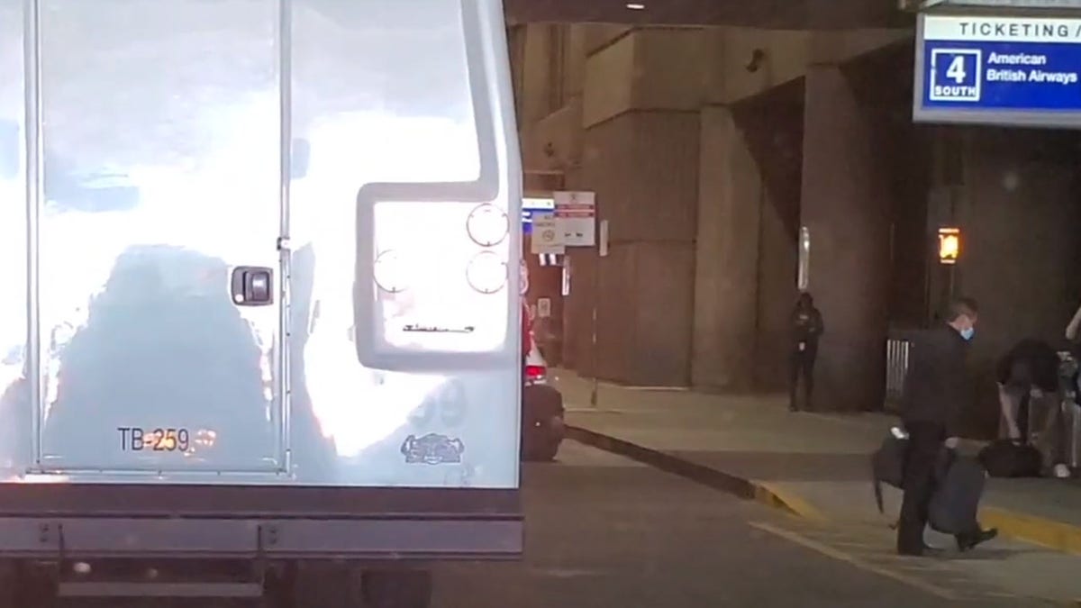 Migrants are dropped off at an airport.