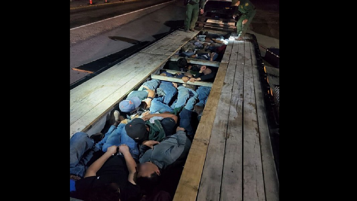 The Border Patrol says its Del Rio, Texas, sector discovered 20 people stuffed underneath the boards of a truck's trailer. (Border Patrol/Chief Patrol Agent Austin Skero)