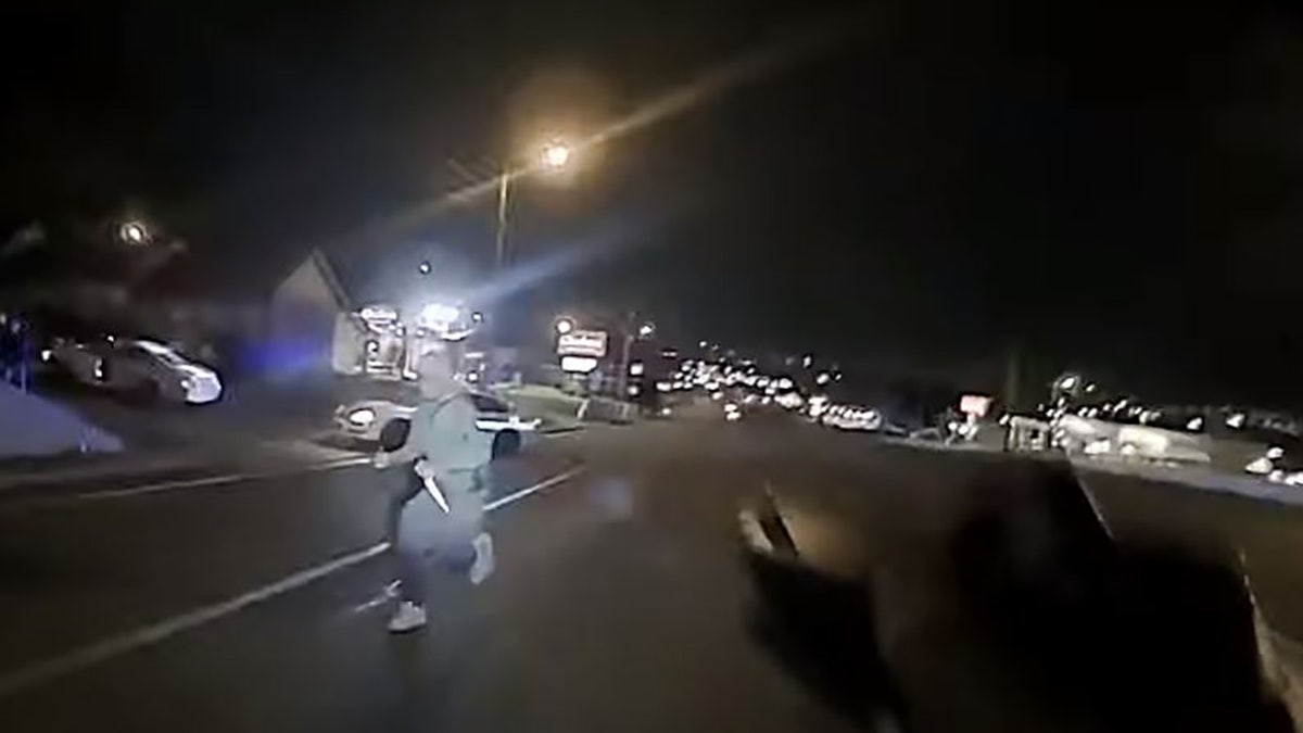 This screengrab taken from police body camera footage shows an unidentified man armed with at least one butcher knife running toward Officer Christopher Royer. (Metro Nashville Police Department)