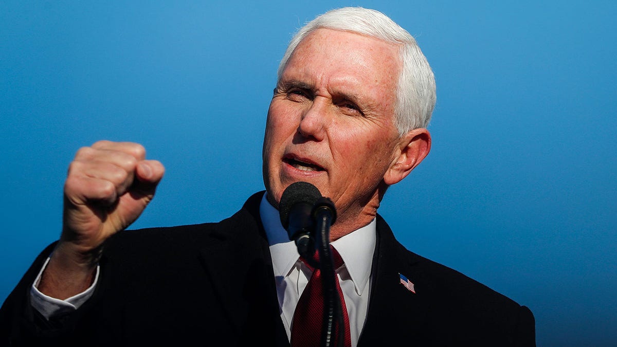Former Vice President Mike Pence gives remarks to a small crowd on Wednesday, Jan. 20, 2021 at Columbus Municipal Airport in Columbus, Indiana.